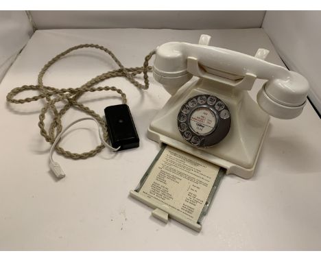 A VINTAGE IVORY BAKELITE TELEPHONE WITH NUMBER STORAGE DRAWER WIRED FOR MODERN USE BUT NO WARRANTY 