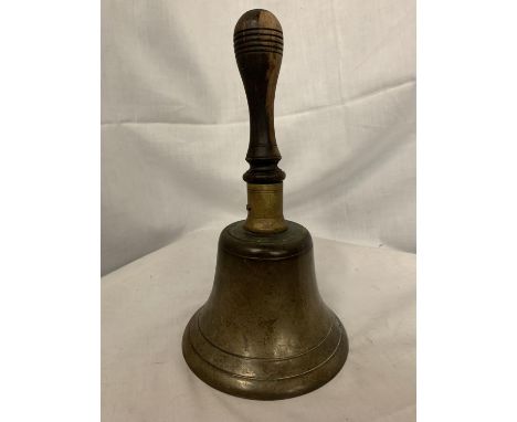 A VINTAGE BRASS SCHOOL BELL WITH WOODEN HANDLE 