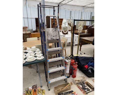 THREE VARIOUS STEP LADDERS TO INCLUDE A FOUR RUNG ALLUMINIUM LADDER AND TWO TUBULAR METAL LADDERS 