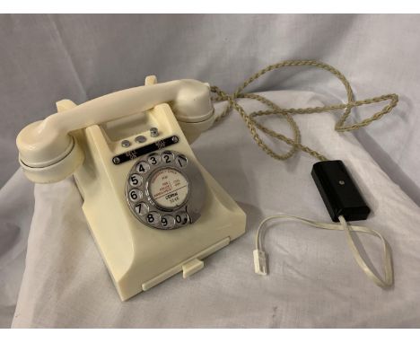 A VINTAGE IVORY BAKELITE TELEPHONE WITH BELL ON/OFF BUTTON AND PULL OUT NUMBER TRAY WIRED FOR MODERN USE BUT NO WARRANTY 