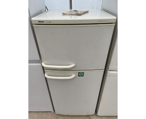A WHITE BOSCH CLASSIX UPRIGHT FRIDGE FREEZER WITH INSTRUCTION MANUAL 