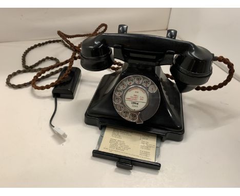 A VINTAGE BLACK BAKELITE TELEPHONE WITH PULL OUT NUMBER TRAY WIRED FOR MODERN USE BUT NO WARRANTY 
