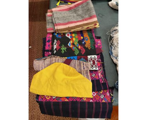 A QUANTITY OF TEXTILES IN PINKS, BLACK, YELLOW, BLUES AND GREY 