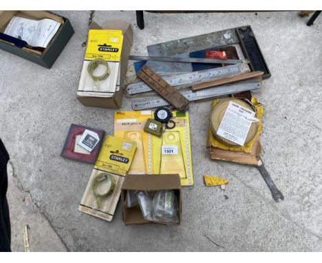 AN ASSORTMENT OF TOOLS TO INCLUDE RULERS, TAPE MEASURES AND SET SQUARES ETC 
