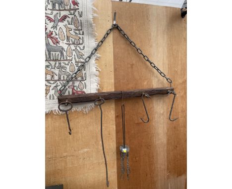 A VINTAGE HANGING FRAME WITH VARIOUS BLACKSMITHS TOOLS 