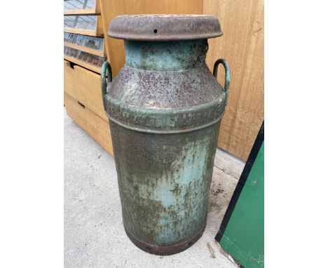 A VINTAGE CAST IRON MILK CHURN WITH LID BEARING THE STAMP NEWHALL DAIRIES LIMITED 