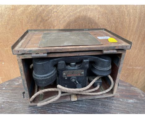 A VINTAGE WOODEN CASED FIELD TELEPHONE 