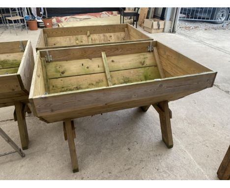 A LARGE WOODEN TROUGH PLANTER (120CM X 84CM X 79CM) 