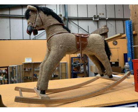A VINTAGE ROCKING HORSE (ONLY ONE STIRRUP) 