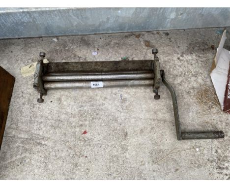 A VINTAGE METAL SHEET ROLLER 