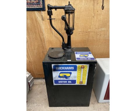 A VINTAGE MANUAL PUMP OIL DISPENSER 