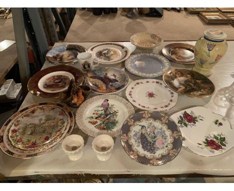 A NUMBER OF DECORATIVE PLATES, A PAIR OF CANDLE STICKS AND A CERAMIC SQUIRRELL AND BASKET 