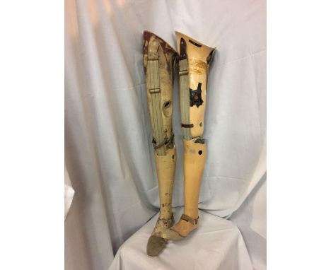 TWO VINTAGE PROSTHETIC LEGS 