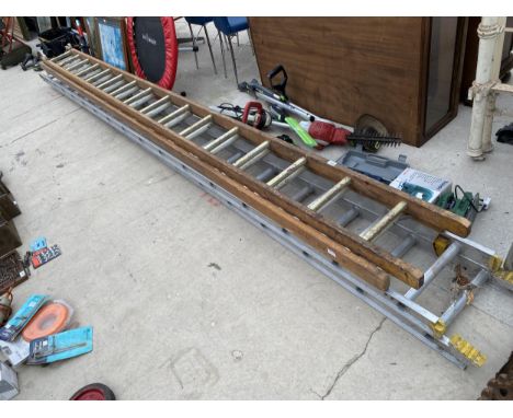 A TWO SECTION WOODEN EXTENDING LADDER (16 RUNG PER SECTION) AND A TWO SECTION ALLUMINIUM EXTENDING LADDER (16 RUNG PER SECTIO