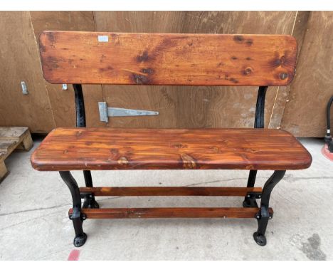 A VINTAGE WOODEN TRAM BENCH WITH CAST ENDS (L:105CM) 
