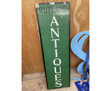 A VINTAGE WOODEN 'RUTLAND ANTIQUES' SIGN 