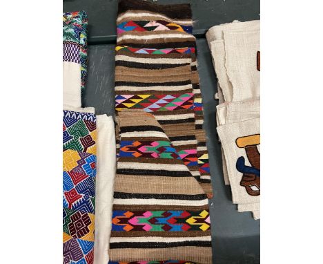 THREE PIECES OF TEXTILES IN CREAMS, BROWNS AND BRIGHT COLOURS. 