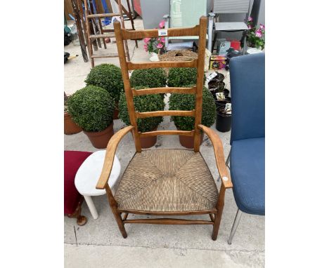 AN ARTS &amp; CRAFTS STYLE BEECH RUSH SEATED LADDER BACK CHAIR 