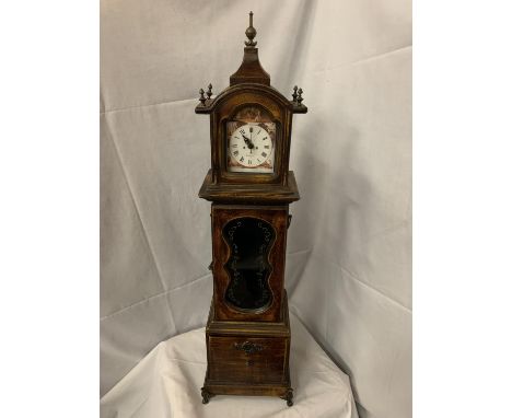 A VINTAGE STYLE CLOCK WITH STORAGE CUPBOARD AND DRAWER 