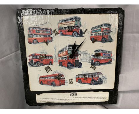 A SLATE WALL CLOCK WITH PICTURES OF VINTAGE BUSES 