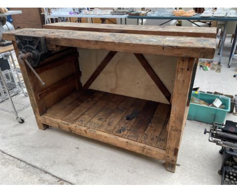 A VINTAGE WOODEN WORK BENCH WITH WITH RECORD NO.52 BENCH VICE 