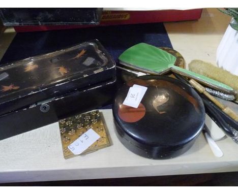 A group comprising: two Japanese lacquer boxes, early 20th century; two hand mirrors, one painted, the other enamel; a white 