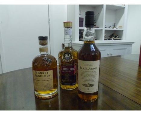 Three bottles of Scotch malt whisky:  Monkey Shoulder, Batch 27 blended malt; The Tormore Glenlivet, 10 years old, pure Highl
