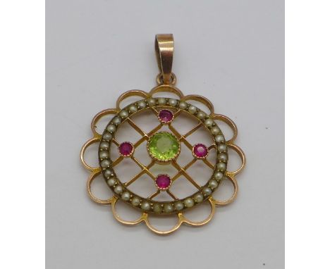A 9ct gold Art Nouveau pendant set with peridot, ruby and seed pearl