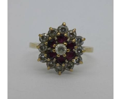 A 9ct gold, diamond and ruby cluster ring, weight 2.6g, size S