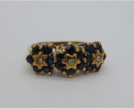 A 9ct gold, sapphire and diamond triple cluster ring, weight 3.8g, size R
