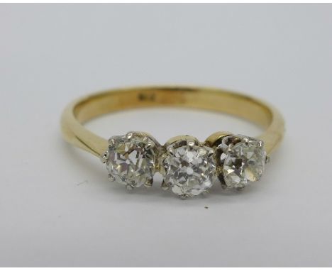 A 1920's, 18ct gold three stone old cut diamond trilogy ring, 1ct diamond weight, weight 2.6g, size R