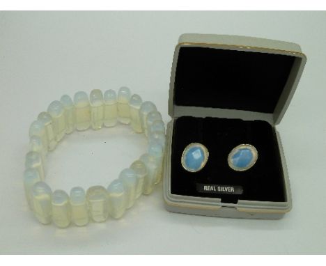 A pair of silver and opalite earrings and a bracelet