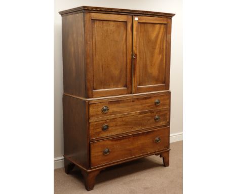 George III mahogany linen press, two panelled doors above two false and one long drawer, dentil cornice and bracket feet, W11