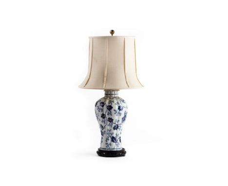 A BLUE AND WHITE PORCELAIN TABLE LAMP
In the form of a fluted vase and cover, with shade
81cm high
Condition: Minor signs of 