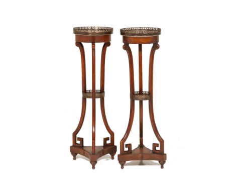 A PAIR OF TRIPOD JARDINIERES OR GUERIDONS
Late 20th Century
With marble top and open work brass gallery, the tripod supports 