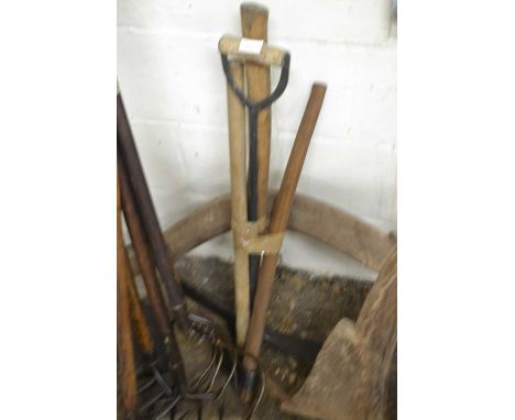 Bundle of mixed implements to include pickaxes and hand axe