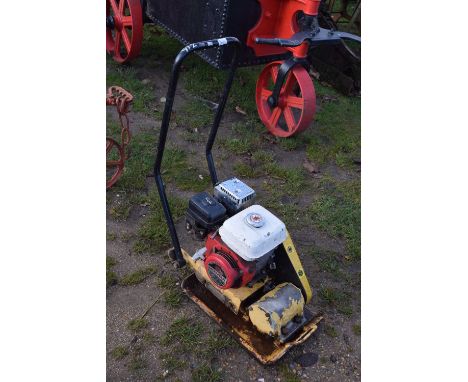 A wacker plate with Honda engine