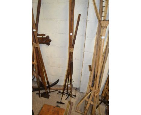 Bundle of various tools to include large silage knife, rake etc