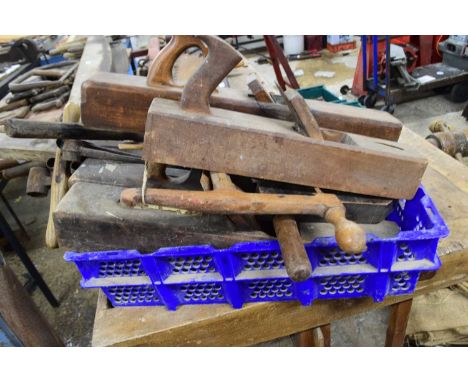 Box of various augur drills, wooden block planes, spirit level etc