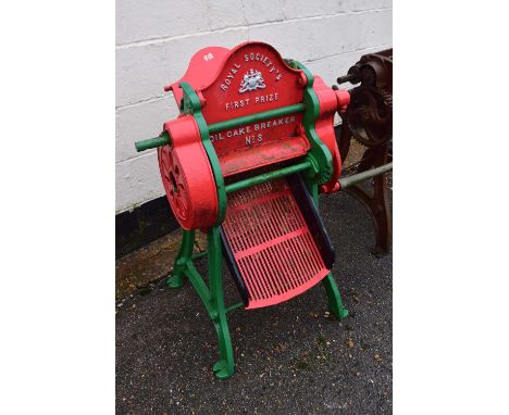 An oil cake breaker, NOS Royal Society's First Prize model painted in red and green