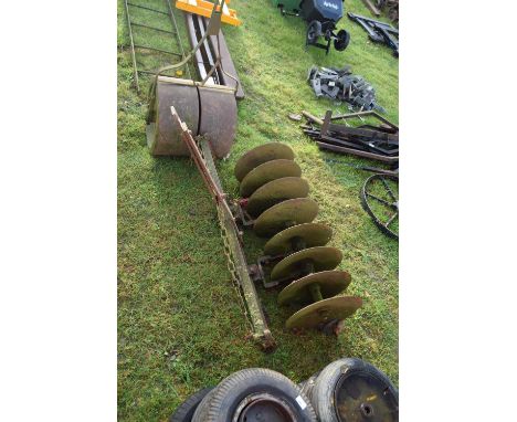 An iron disc cultivator together with a small iron roller (2)