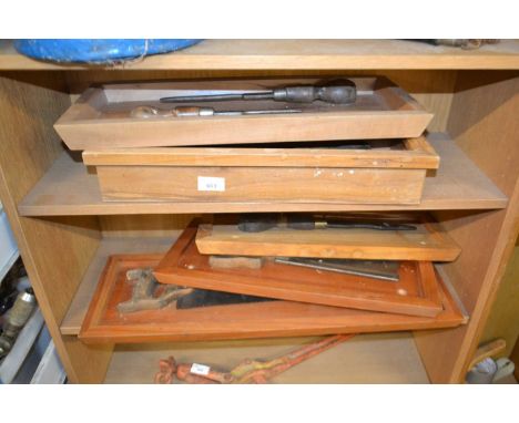 Five various display boards of chisels, saws and woodworking tools