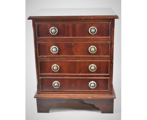 A Miniature Mahogany Four Drawer Chest with Circular Brass Drop Handles on Bracket Feet, 42x29x41cm high 