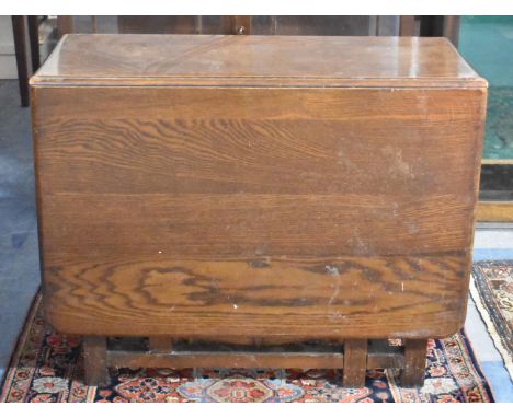 An Edwardian Oak Drop Leaf Gate Legged Dining Table, 91cm wide 