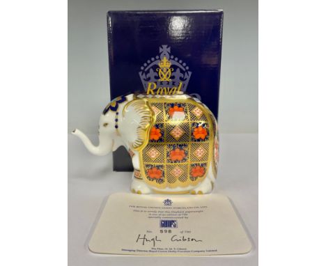 A Royal Crown Derby paperweight, Gump's Imari Elephant, trunk raised, limited edition 598/750, gold stopper, 10cm high, print