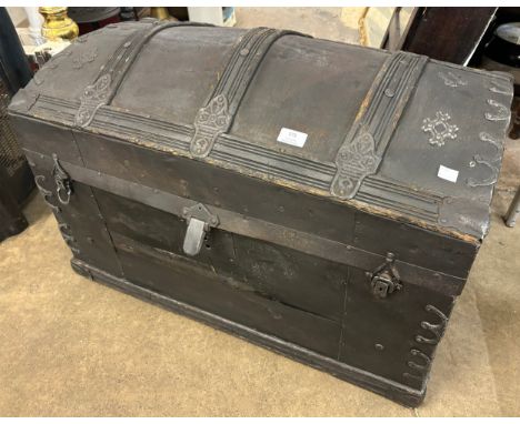 A Victorian metal bound domed top steamer trunk 