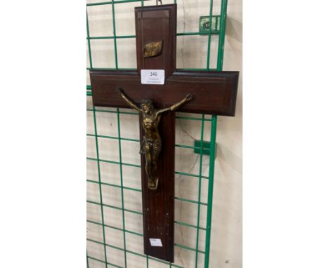 An early 20th Century brass and oak crucifix 