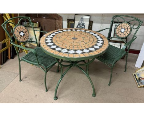 A cast metal and mosaic tile topped garden table and two chairs 