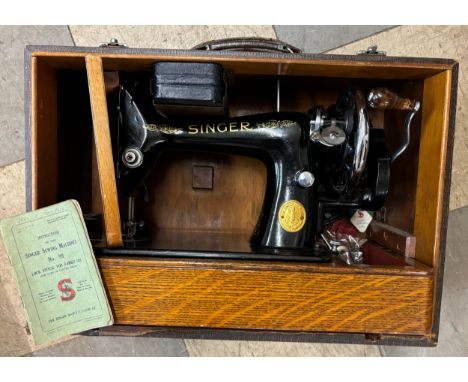 A cased Singer sewing machine 