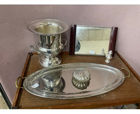 A collection of plated items, including a fish tray, champagne bucket, butter dish, salt pot and mirror